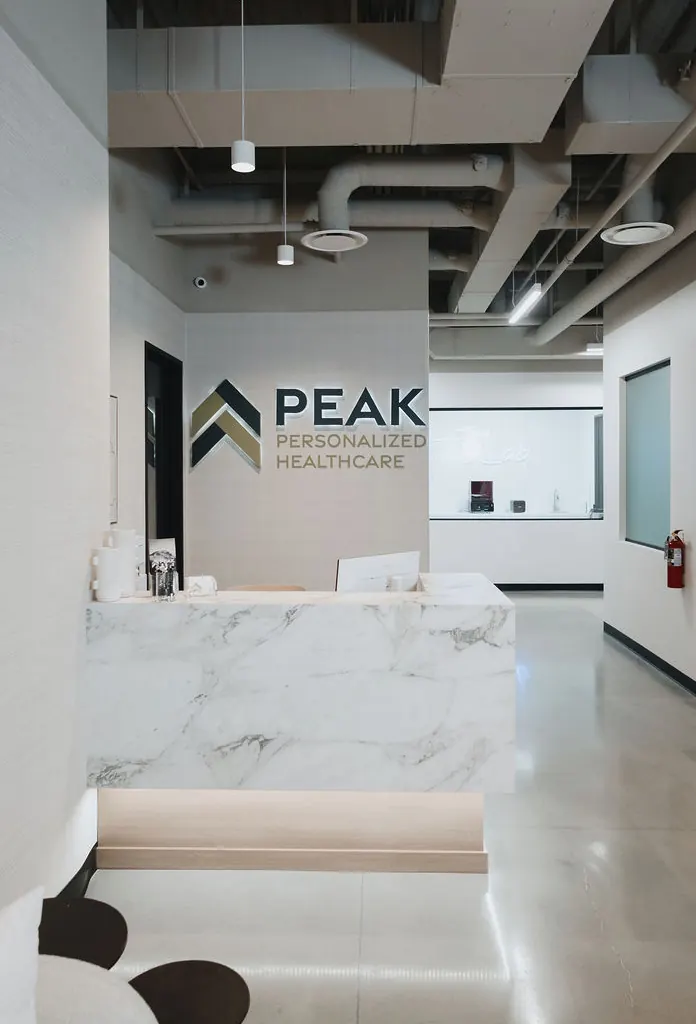 Peak reception desk with the Peak Personalized Healthcare logo