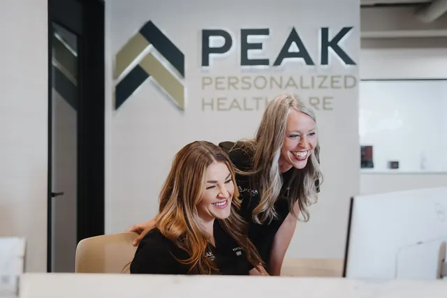 Peak front desk team greeting patients