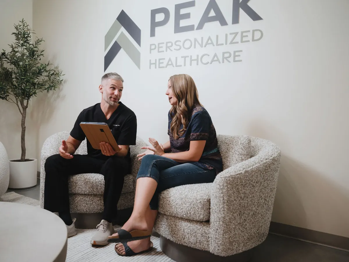 Dr. Lyall reviewing results on a tablet with a patient